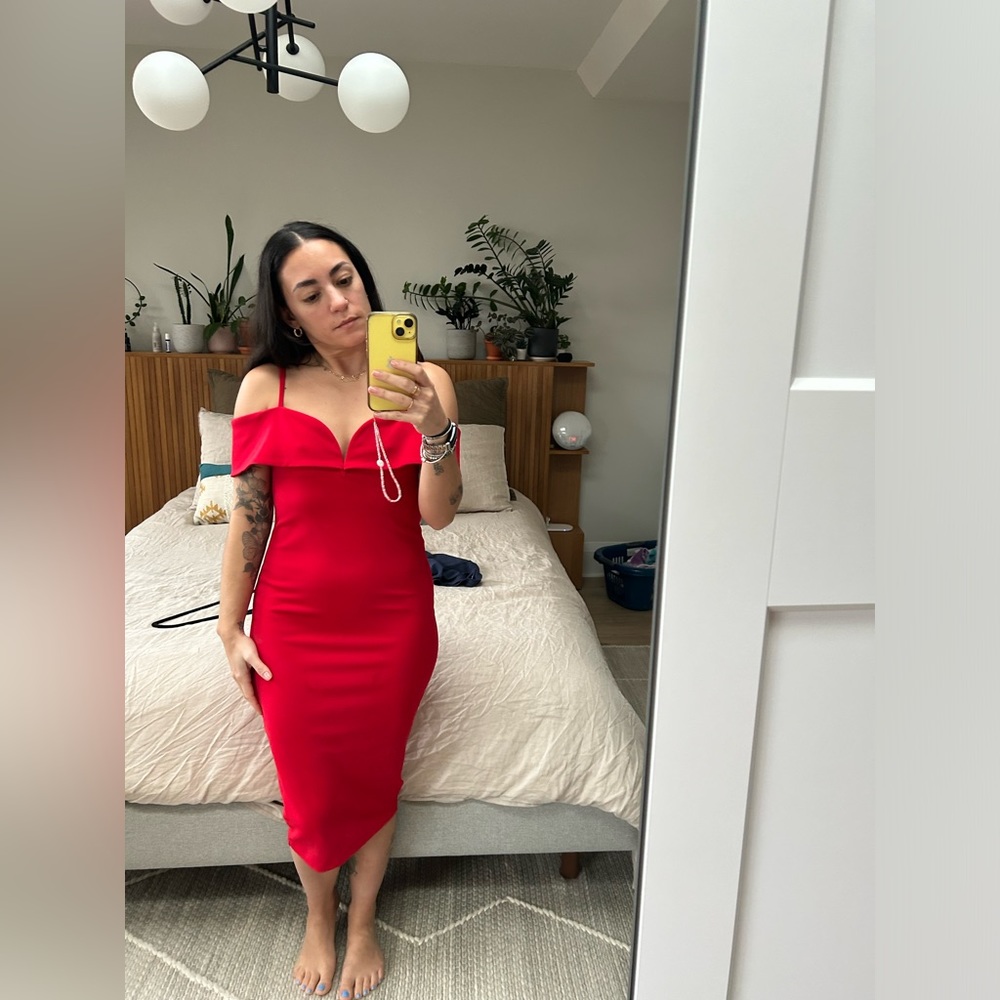 Red slim fitting dress perfect for a wedding guest